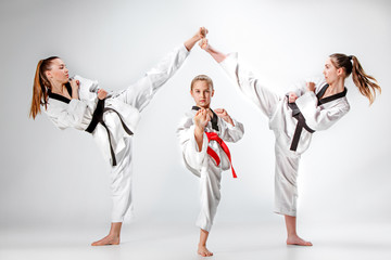 The studio shot of group of kids training karate martial arts