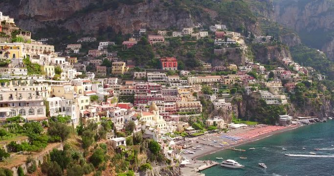 Flying close to italian village in front of the sea