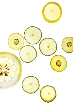 Yellow and green lemons, grapefruit, kiwi and pomelo in transparency