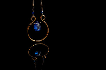 Copper jewelry isolated on black background