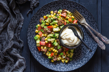 Salad with avocado tomato corn mushrooms and mayonnaise