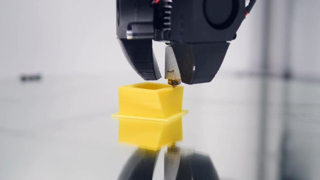 3D printer. Printing with Plastic Wire Filament on 3D Printer. 4K.