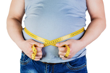 The belly of a fat man isolated on white background. Fat man holding a measuring tape. Weight Loss.