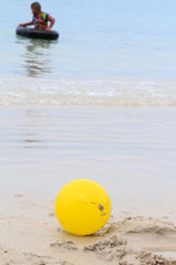 Yellow ball on beach