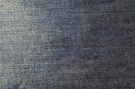 Texture of a blue jeans.  Fabric background