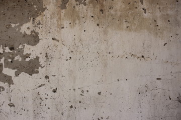 a wall of old grey plaster