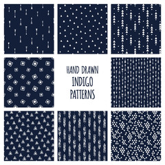 Dark blue indigo set of patterns. Hand drawn vector triblal backgrounds with triangles and arrows.