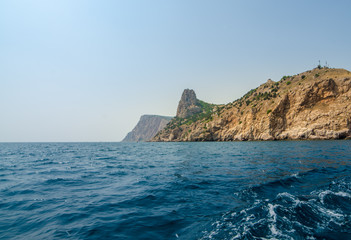 Fototapeta na wymiar Sea, rocks and mountains. Open sea, a view of the rocks and mountains near Balaklava, Crimea