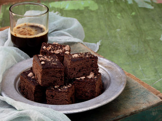 pieces of cake chocolate brownies on wooden background. selective focus.