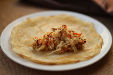 Pancakes with filling (stewed cabbage with vegetables)
