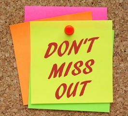 The words Don't Miss Out in red text on a yellow sticky note as a reminder not to overlook an opportunity