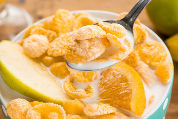 Healthy home made breakfast of muesli, apples, fresh fruits and walnuts