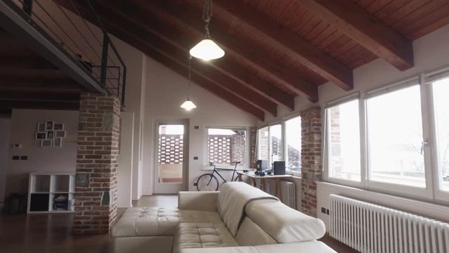 point of view walking into modern industrial style house with vintage bike. 4k POV forward dolly shot