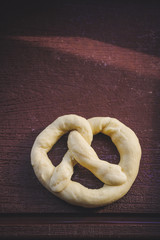 Brezel - forming raw dough (homemade pastry)