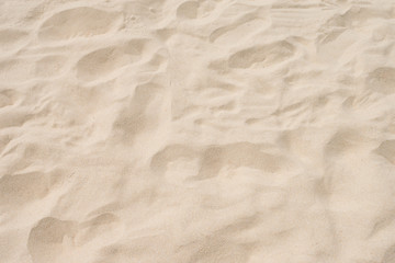 Fototapeta na wymiar closeup of sand pattern of a beach in the summer