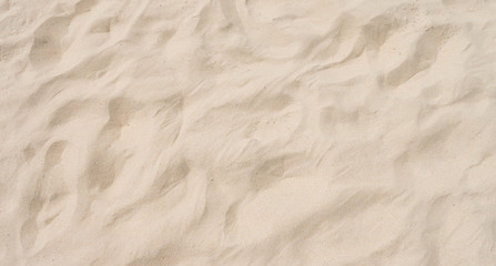 closeup of sand pattern of a beach in the summer