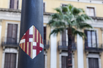 Shield of the city in a streetlight, Barcelona,Spain.