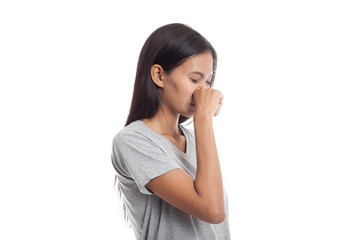 Fototapeta premium Young Asian woman holding her nose because of a bad smell.