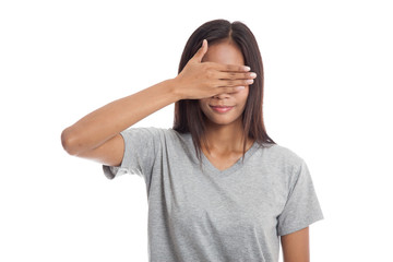 Young Asian woman close her eyes with hand.