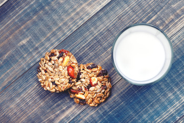 A healthy breakfast consisting of kozinaki and a glass of milk. View from above