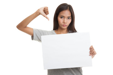 Fototapeta premium Young Asian woman show thumbs down with white blank sign.