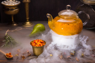 Tea from berries of a sea-buckthorn and raspberry with addition of sugar syrup