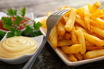 Close up of fork on french fries