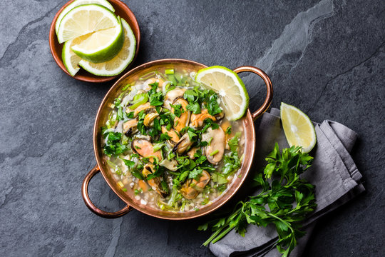 Seafood ceviche or mariscal in copper bowl - traditional Latin American dish with seafood, onion and lemon