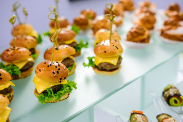 Delicious mini cheeseburgers. Selective focus. Catering for party.