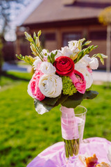 The wedding bouquet stands on the table