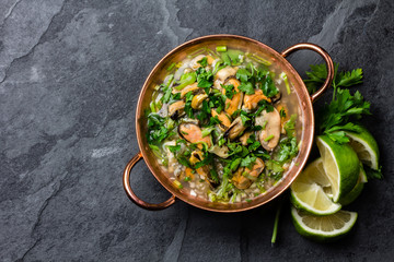 Ceviche - raw seafood cold soup with mussels, vongole, clams . Traditional dish of Peru and Chile