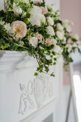 Flower arrangement with branches of a pistachio branches of Ruscus, carnations, roses, branch of Brunei, berries of Hypericum. Wedding concept