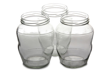 Empty glass jars on white background