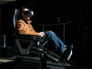 Man on virtual reality simulator