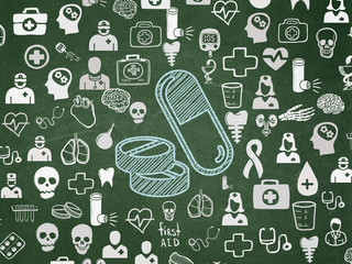 Healthcare concept: Pills on School board background