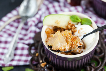 Apple crumble dessert with vanilla ice cream
