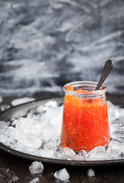 Red caviar in a glass jar