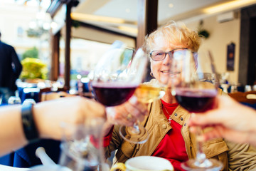 women celebrate over wine in Piano di Sorrento, Italy