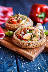 Buns stuffed with mushrooms, bell pepper, eggs and bacon