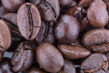 Naklejka premium Grain coffee close-up, top view, macro, white isolated background