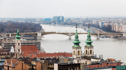 Cityscape of Budapest and Danube river with haze on the horizon after the rain