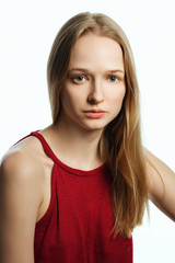 Portrait of a woman without makeup. Model test. Fashion model. White background.