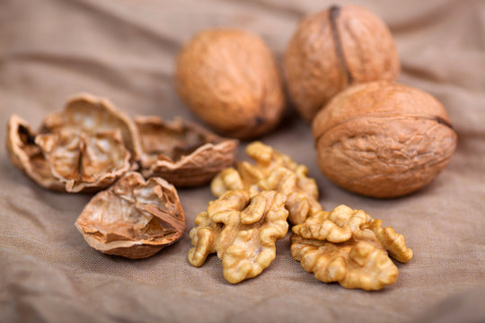 Walnut without shell close-up, and nuts in the shell