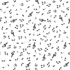 Obraz premium Black and white seamless background with music notes for graphic design.