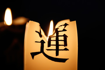 Burning candle with a hieroglyph