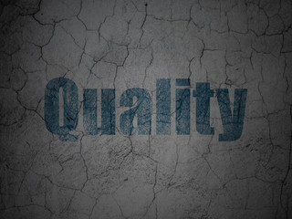 Advertising concept: Quality on grunge wall background