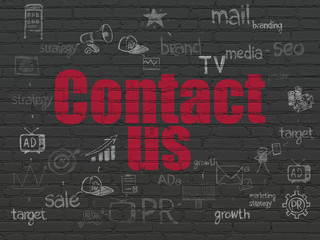 Advertising concept: Contact Us on wall background