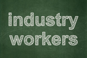 Fototapeta premium Manufacuring concept: Industry Workers on chalkboard background