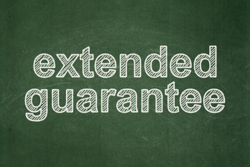 Obraz premium Insurance concept: Extended Guarantee on chalkboard background