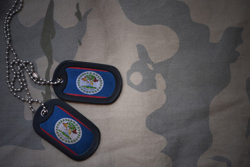 army blank, dog tag with flag of belize on the khaki texture background. military concept
